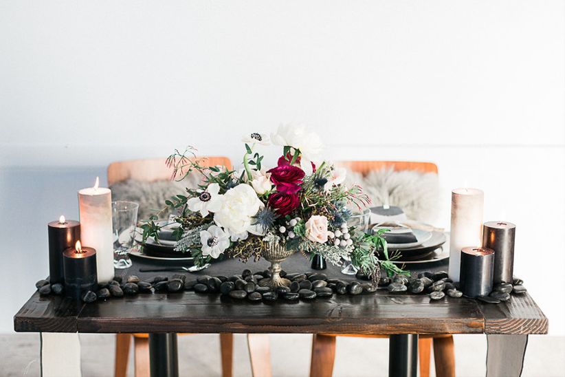 moody wedding tablescape, black and burgundy centerpiece with flowers and candles